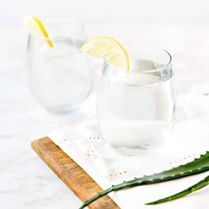 Two glasses of infused water with Aloe Vera drink and lemon